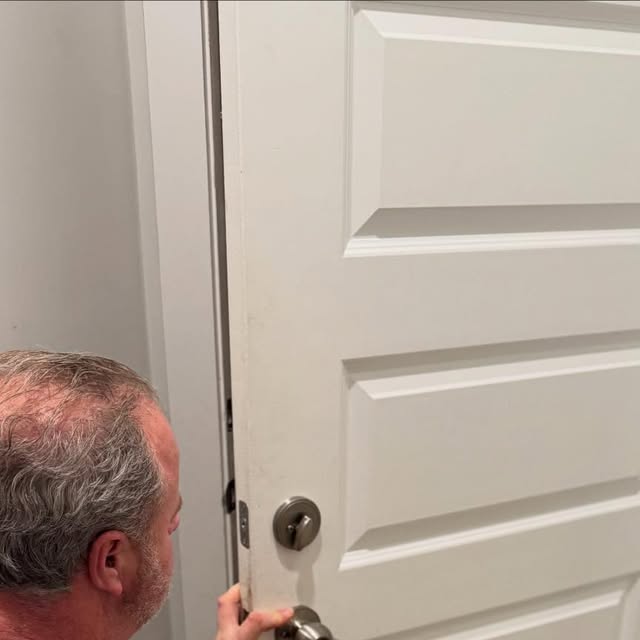 Will from Colio Home Solutions fitting a door